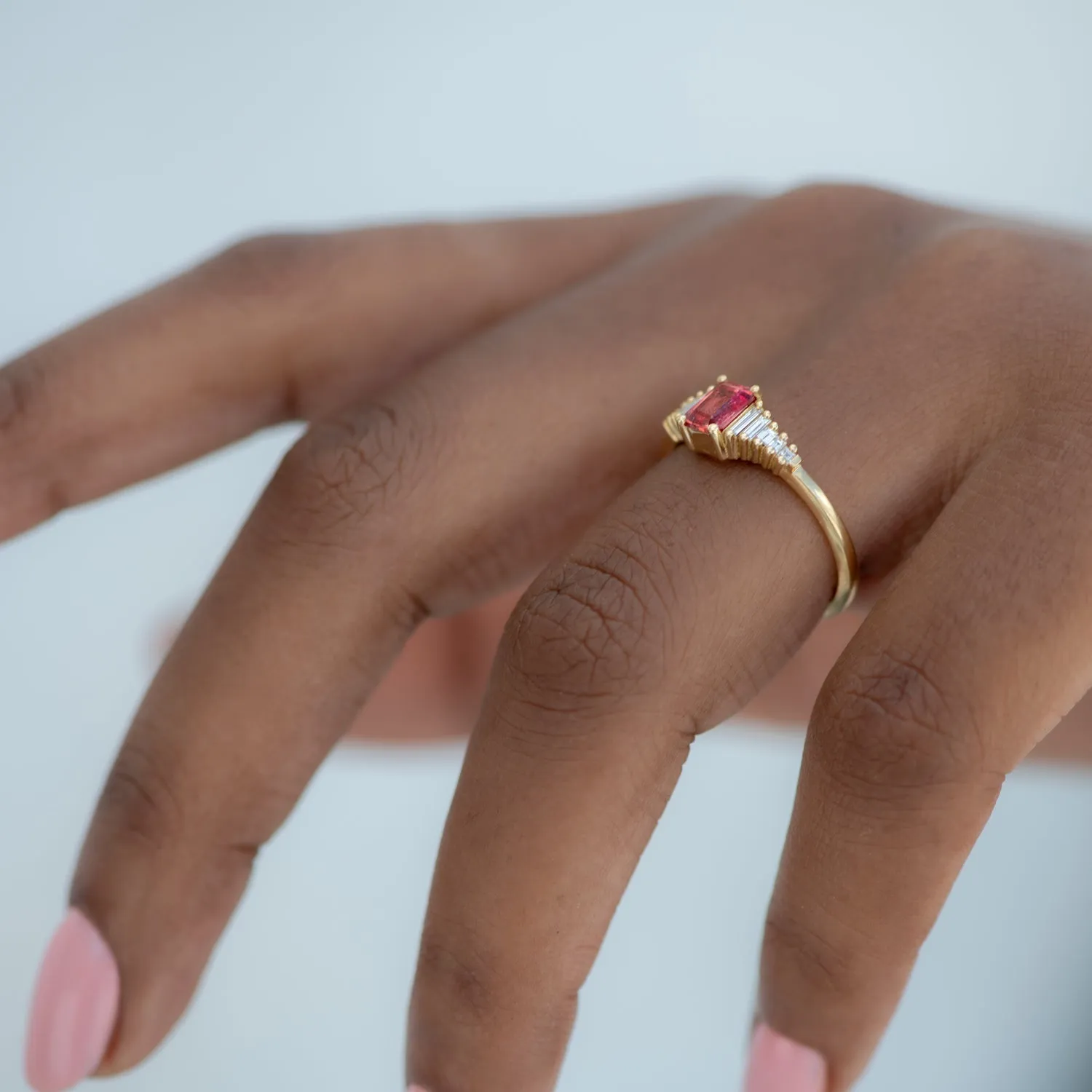 Padparadscha Sapphire Engagement Ring with Baguette Diamond Detailing